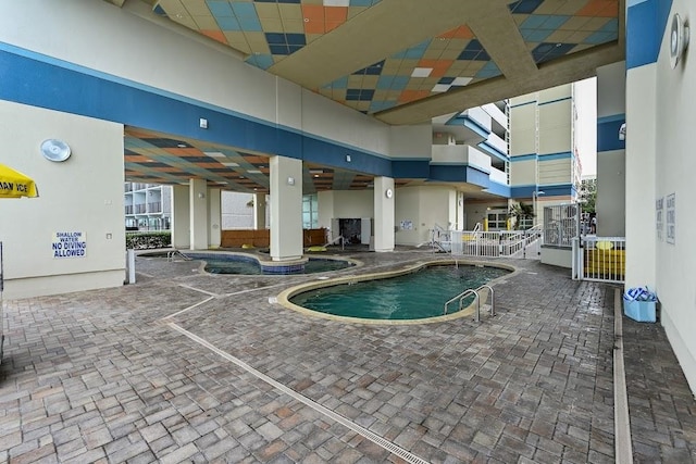 view of swimming pool featuring a patio area