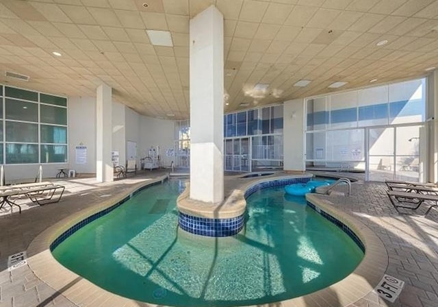 view of swimming pool with a patio