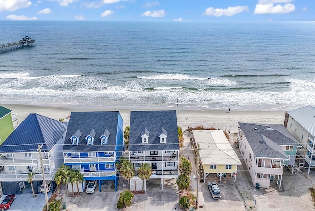 drone / aerial view with a view of the beach and a water view