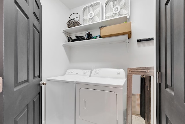 washroom featuring washer and dryer and laundry area