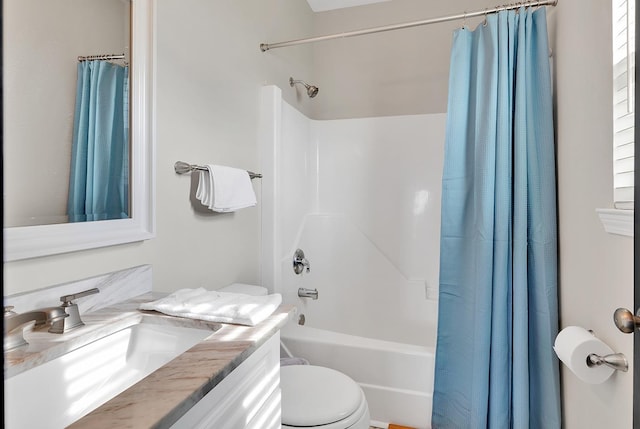 full bath with toilet, shower / bathtub combination with curtain, and vanity