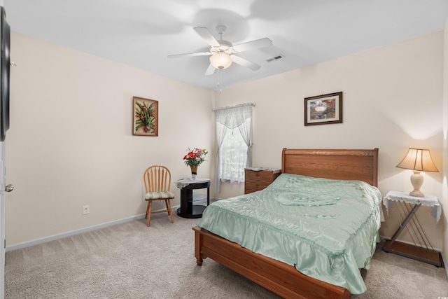 bedroom featuring ceiling fan and light carpet