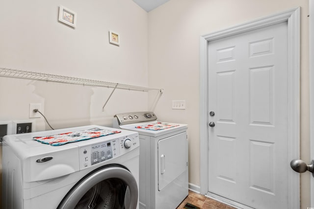 laundry room featuring separate washer and dryer