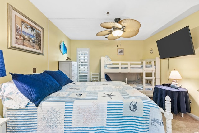 carpeted bedroom featuring ceiling fan