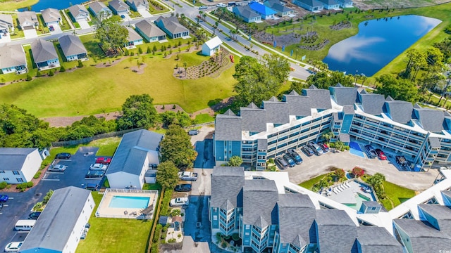 birds eye view of property featuring a water view