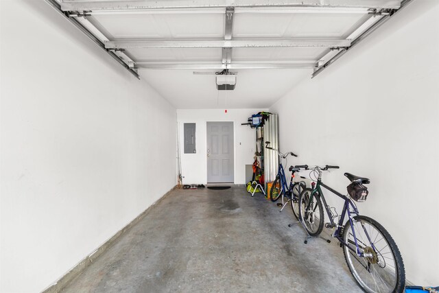 garage featuring a garage door opener and electric panel