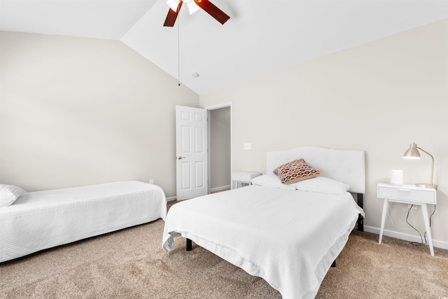 carpeted bedroom with baseboards, vaulted ceiling, and a ceiling fan