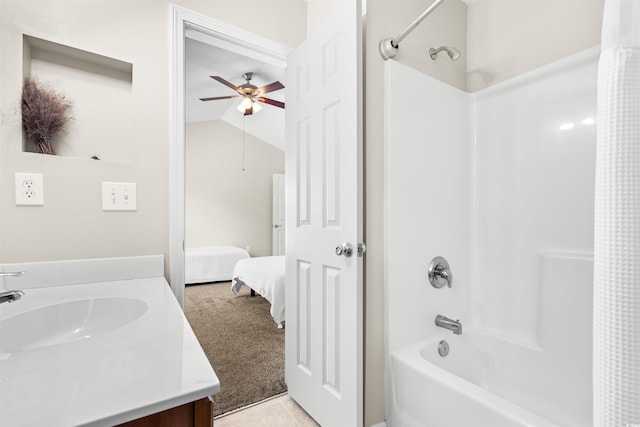 ensuite bathroom featuring shower / bath combination with curtain, lofted ceiling, a ceiling fan, connected bathroom, and vanity