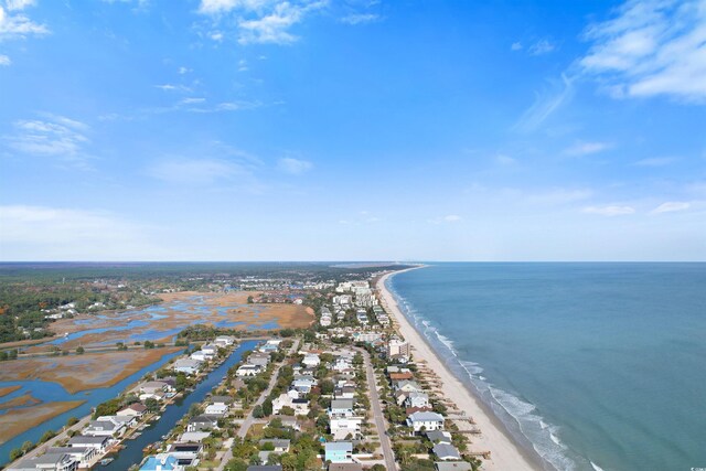 drone / aerial view with a view of the beach and a water view