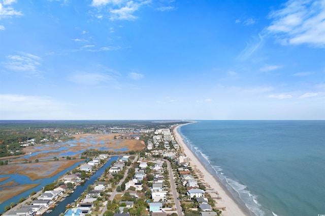 bird's eye view featuring a water view and a beach view