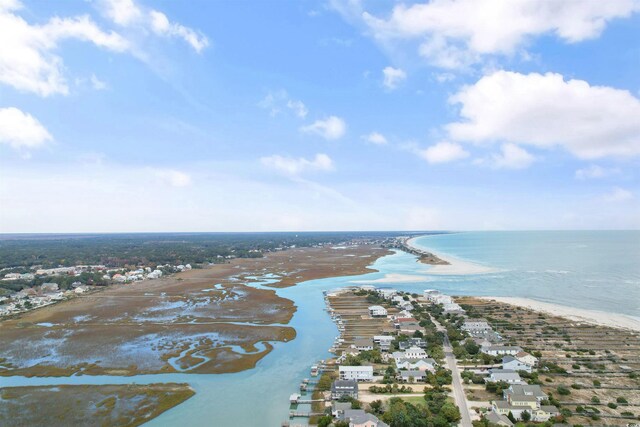 drone / aerial view featuring a view of the beach and a water view