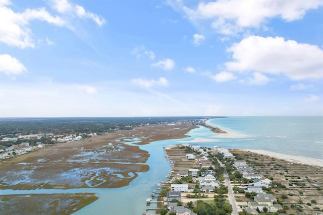 bird's eye view featuring a water view and a beach view