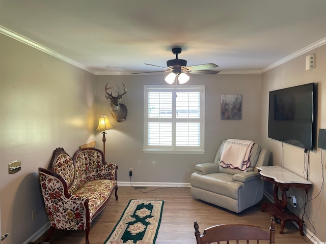 living room featuring ceiling fan, crown molding, and hardwood / wood-style floors