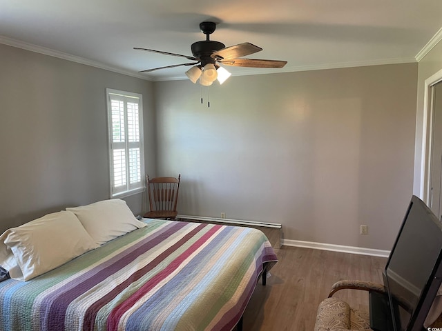 bedroom with ceiling fan, hardwood / wood-style flooring, and ornamental molding