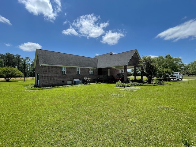 rear view of property featuring a yard