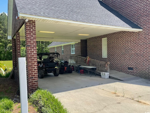 view of patio / terrace featuring a carport