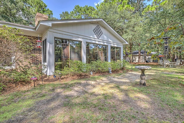 exterior space featuring a sunroom