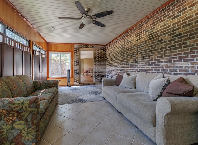 sunroom / solarium with a ceiling fan and visible vents