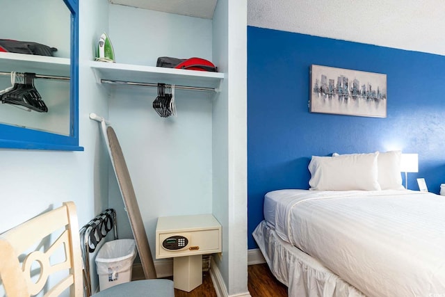 bedroom with dark wood-type flooring