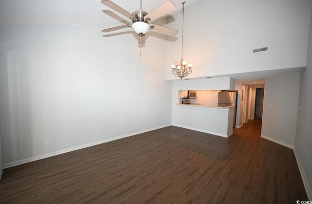 unfurnished living room featuring ceiling fan, dark hardwood / wood-style flooring, and high vaulted ceiling