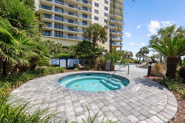 view of pool featuring a community hot tub