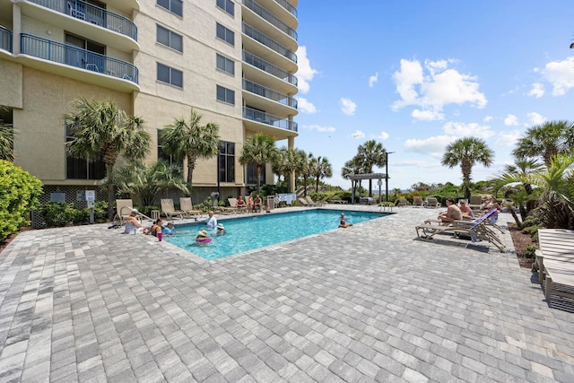 view of swimming pool with a patio