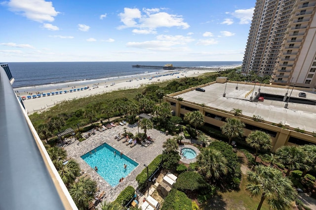 birds eye view of property featuring a view of the beach and a water view