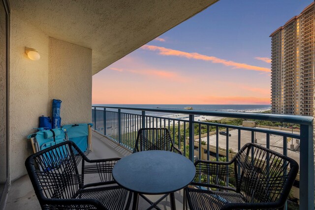 balcony at dusk with a water view