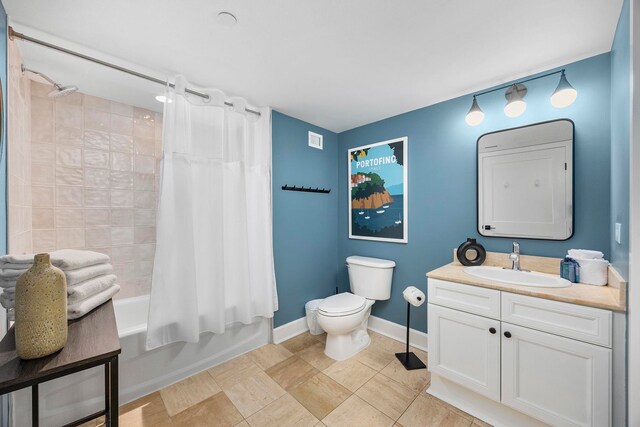 full bathroom featuring shower / bath combo, toilet, tile patterned floors, and vanity