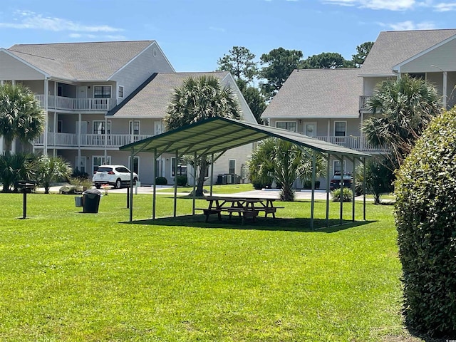 view of home's community featuring a lawn