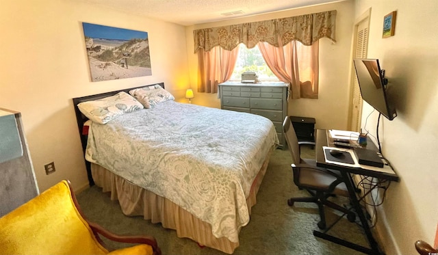 carpeted bedroom with a textured ceiling