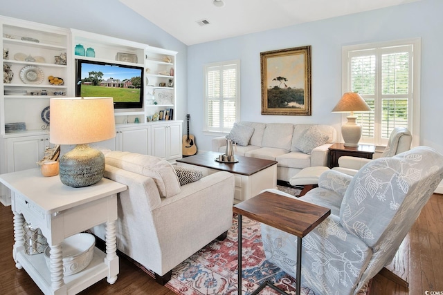 living room with lofted ceiling and dark hardwood / wood-style flooring