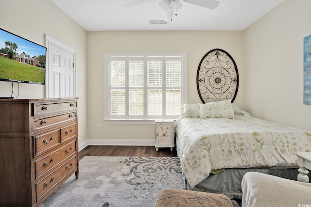 bedroom featuring ceiling fan and dark hardwood / wood-style floors