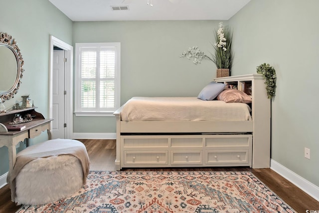 bedroom with hardwood / wood-style flooring