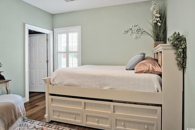 bedroom with wood-type flooring