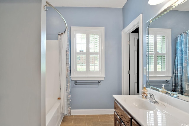 bathroom featuring tile patterned flooring, plenty of natural light, vanity, and shower / bath combo