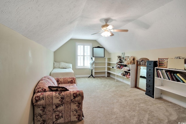 living area featuring a textured ceiling, ceiling fan, lofted ceiling, and light carpet