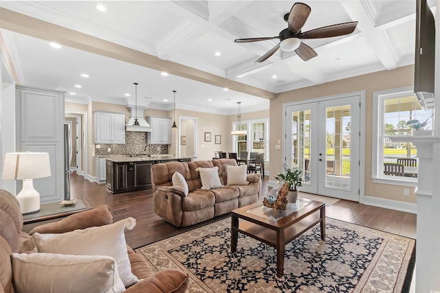 living room with beamed ceiling, french doors, ceiling fan, and coffered ceiling