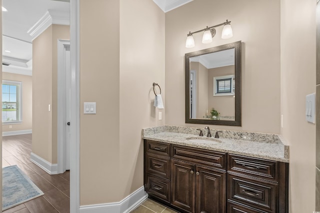 bathroom featuring vanity and ornamental molding