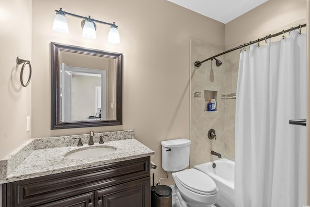 full bathroom with shower / tub combo, vanity, and toilet