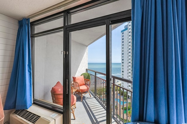 balcony featuring a water view