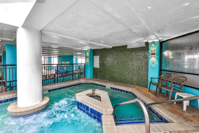 view of pool featuring an indoor hot tub