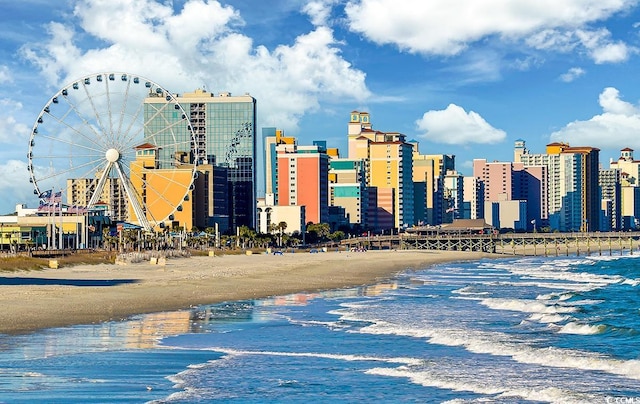 view of city with a view of the beach and a water view