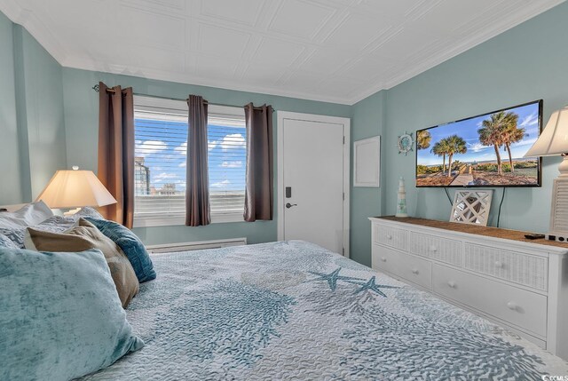 bedroom featuring crown molding and baseboard heating