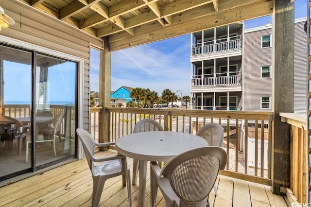 4305 S Ocean Blvd Unit 106, North Myrtle Beach, SC 29582 - wooden terrace featuring outdoor dining area
