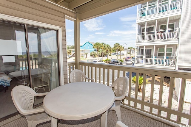 balcony featuring outdoor dining area