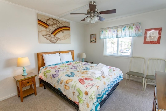 carpeted bedroom with ceiling fan, baseboards, and ornamental molding