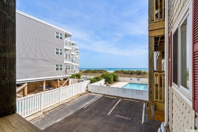 4305 S Ocean Blvd Unit 106, North Myrtle Beach, SC 29582 - uncovered parking lot with a water view