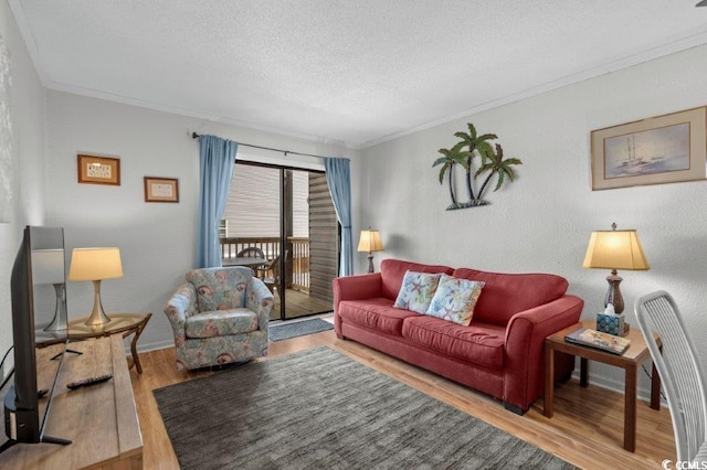 4305 S Ocean Blvd Unit 106, North Myrtle Beach, SC 29582 - living room with crown molding, wood finished floors, and a textured ceiling