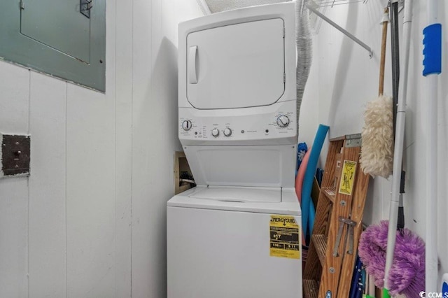 4305 S Ocean Blvd Unit 106, North Myrtle Beach, SC 29582 - washroom with stacked washer and clothes dryer, electric panel, and attic access